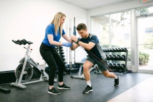 Patient working with a provider at a physical therapy clinic in Farmingdale during a comprehensive movement evaluation