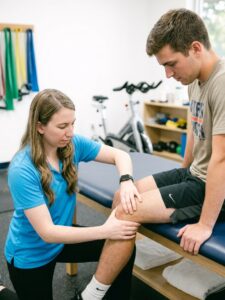 Patient working with a provider at a physical therapy clinic in Farmingdale, NY during a knee injury rehabilitation session