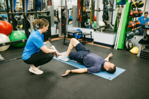 Physical therapist treating lower back pain from golf at In Motion PT in Farmingdale NY